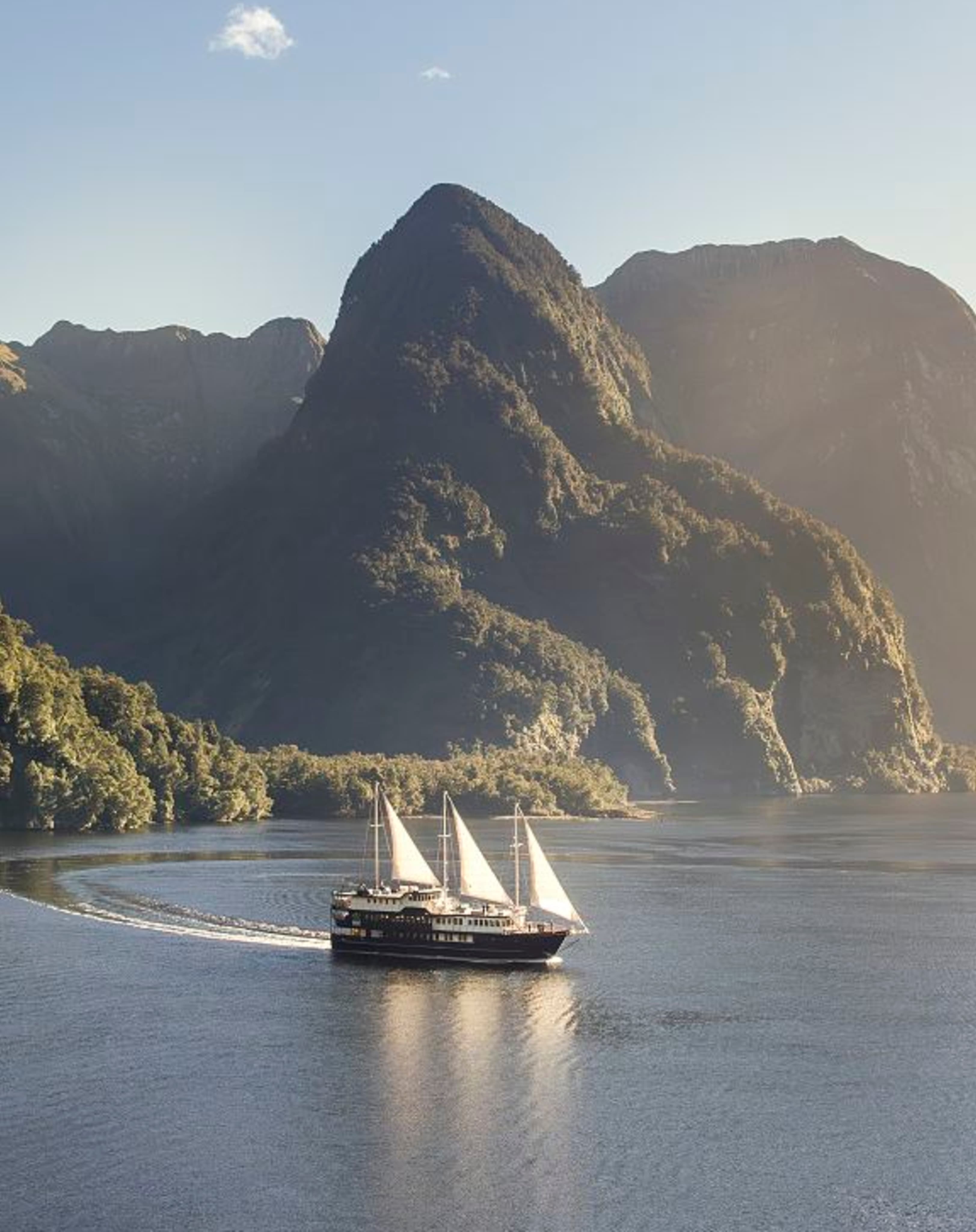 Mountain landscape with sailboat